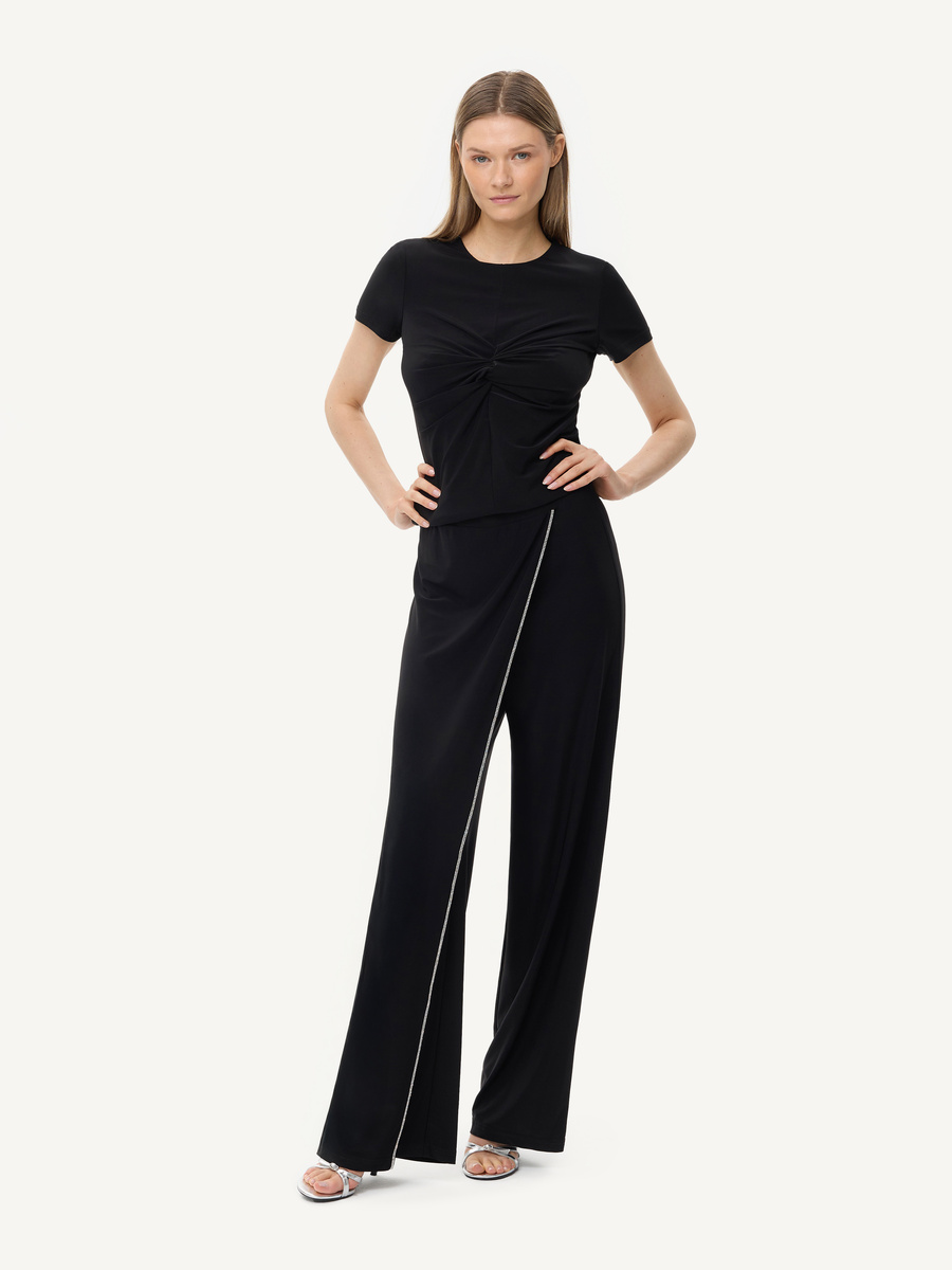 Black evening trousers with draped panel and rhinestone trim